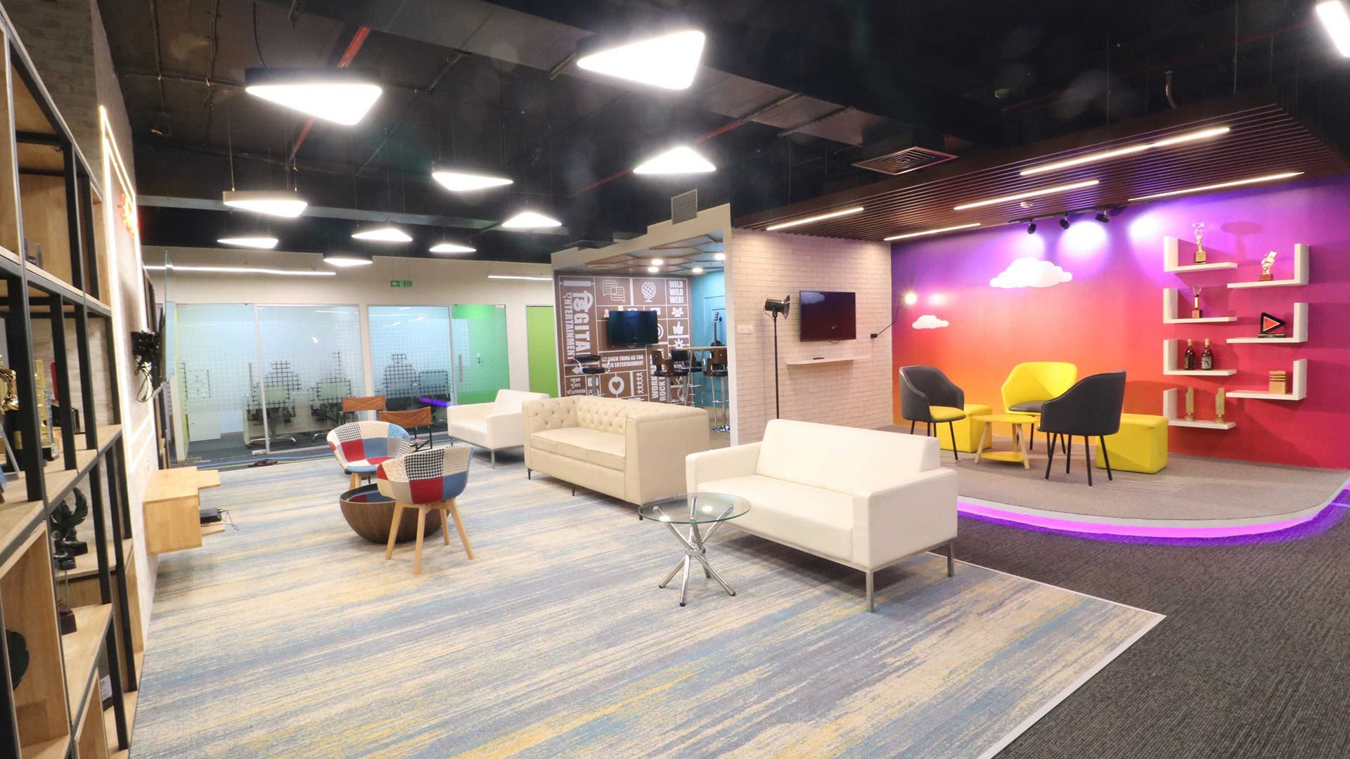 Coordinated ducts, grilles and service lines in an exposed ceiling, Zee office